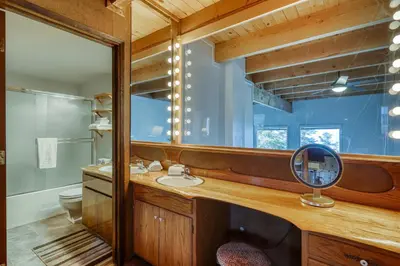 a bathroom with a mirror and a sink at Heavenly View 4 U in Stateline