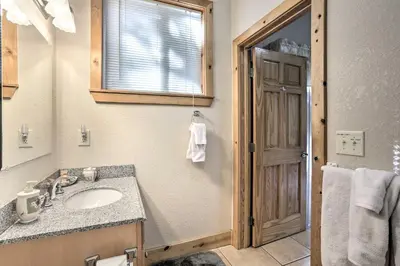 a bathroom with a sink and a mirror at Carnelian Bay Home with Hot Tub Near Tahoe Skiing in Carnelian Bay