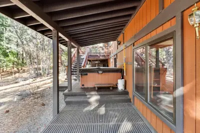 an outside porch of a house with a patio at Lake Tahoe Family Home with Hot Tub and Game Room! in Incline Village