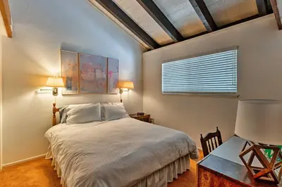 a bedroom with a large bed and a window at Ski Condo with Beach Access and 2 Mi to Diamond Peak! in Incline Village