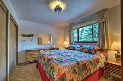 a bedroom with a bed and a dresser and a window at Near Hiking and Skiing Bear Valley Cabin! in Tamarack