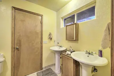 a bathroom with a sink and a toilet at Walk to Big Trees State Park Cabin with Deck! in Dorrington