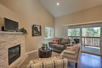 a living room with a fireplace and a tv at 1 Mi to Skiing and Beaches Incline Village Home! in Incline Village