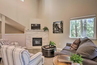 a living room with a couch and a fireplace at 1 Mi to Skiing and Beaches Incline Village Home! in Incline Village