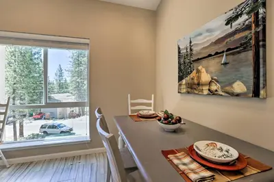 a dining room with a table and a large window at 1 Mi to Skiing and Beaches Incline Village Home! in Incline Village