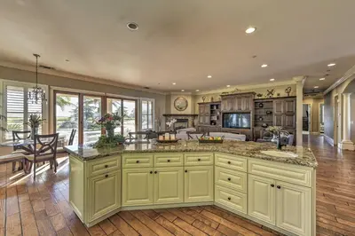 a large kitchen with a large island in the middle at Near Wineries Elk Grove Getaway with Saltwater Pool in Elk Grove