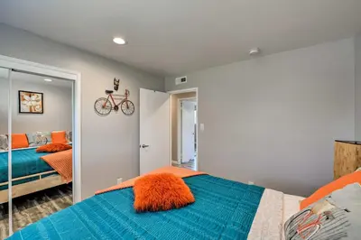 a bedroom with a bed and a bike on the wall at Updated Sacramento Home with Grill, Patio, and Pool! in Sacramento