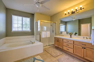 a bathroom with a tub and a shower and a sink at Family-Friendly Tracy House with Patio and Grill! in Tracy