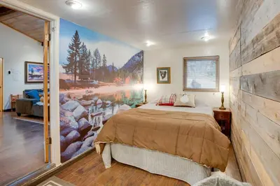 a bedroom with a bed and a large painting on the wall at 3 Mi to Heavenly Mountain Resort Home with Deck in Stateline