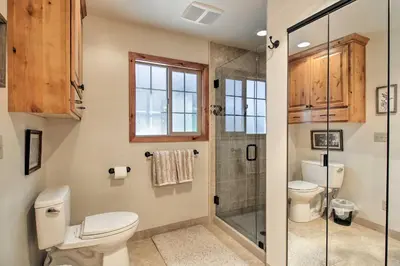 a bathroom with a toilet and a shower at Hot Tub and Lake Tahoe Views Waterfront Retreat in Tahoma