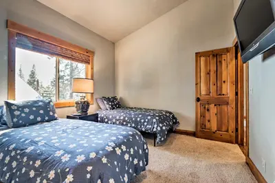 a bedroom with two beds and a window at Truckee Escape with Hot Tub Near Ski Resorts in Truckee