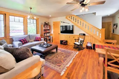 a living room with a couch and a table at Hot Tub and Lake Tahoe Views Kings Beach Lodge in Kings Beach