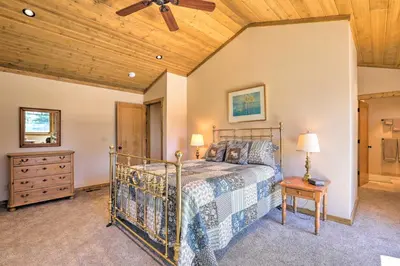 a bedroom with a bed and a wooden ceiling at Hot Tub and Lake Tahoe Views Kings Beach Lodge in Kings Beach