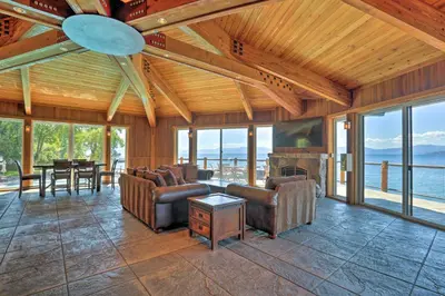 a large living room with couches and a fireplace at Hot Tub and Lake Tahoe Views Kings Beach Lodge in Kings Beach