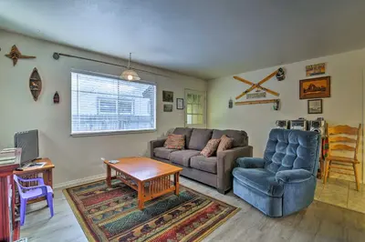 a living room with a couch and a table at Home 1 Mi to Heavenly Mtn Resort! Unwind Fireside in South Lake Tahoe