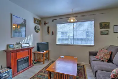 a living room with a couch and a tv at Home 1 Mi to Heavenly Mtn Resort! Unwind Fireside in South Lake Tahoe