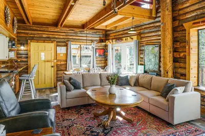a living room with a couch and a table at Sequoia Forest Remote Retreat! Dreamtime Cabin in Ponderosa