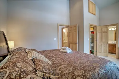 a bedroom with a large bed and a closet at 9 Mi to Heavenly Mountain South Lake Tahoe Home! in South Lake Tahoe