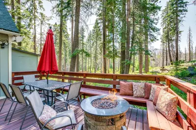 a patio with a table and chairs and a fire pit at Private Mountain Retreat 8 Mi to Lake Tahoe! in South Lake Tahoe