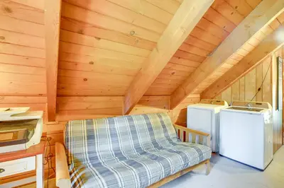 a tiny house with a couch and a washer and dryer at Private Mountain Retreat 8 Mi to Lake Tahoe! in South Lake Tahoe