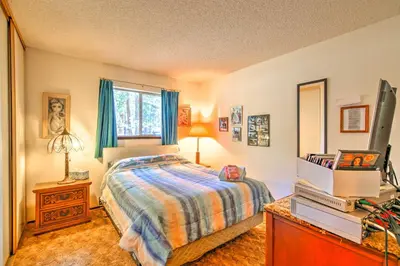 a bedroom with a bed and a television in it at Hike, Bike and Ski South Lake Tahoe Retreat in South Lake Tahoe