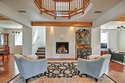 a living room with chairs and a fireplace at 1 Mi to Mtn, 1 More to Shore! Luxury Tahoe Home in South Lake Tahoe