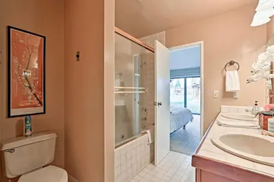 a bathroom with a toilet and a sink and a shower at 1 Mi to Shore Quiet South Lake Tahoe Condo in South Lake Tahoe