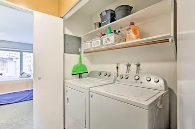 a laundry room with a washer and dryer at 1 Mi to Shore Quiet South Lake Tahoe Condo in South Lake Tahoe