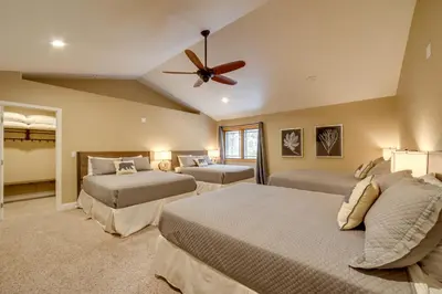 a bedroom with two beds and a ceiling fan at 4 Mi to Ski Mt Rose Sleek Reno-Lake Tahoe Home in Reno