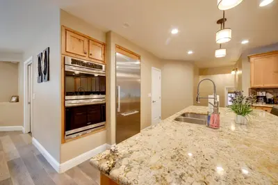 a kitchen with a sink and a counter top at 4 Mi to Ski Mt Rose Sleek Reno-Lake Tahoe Home in Reno