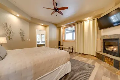 a bedroom with a bed and a fireplace at 4 Mi to Ski Mt Rose Sleek Reno-Lake Tahoe Home in Reno