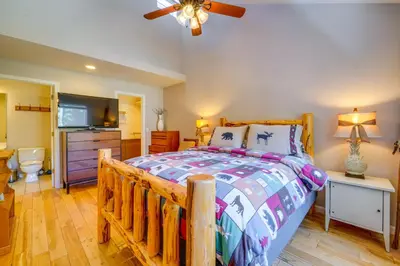 a bedroom with a wooden bed and a bathroom at Incline Village Retreat Near Skiing and Beaches in Incline Village