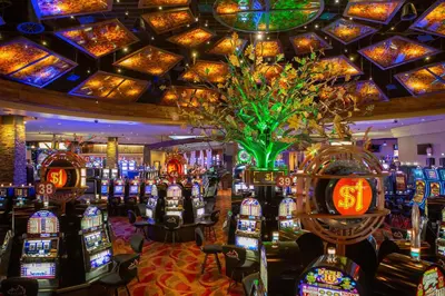a casino filled with lots of slot machines at The Hotel at Black Oak Casino Resort in Tuolumne