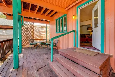 a porch of a home with a table and chairs at Waterfront Truckee Cabin on Donner Lake! in Truckee