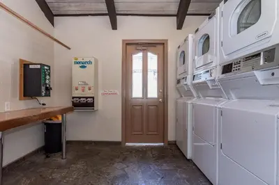 a laundry room with a washer and dryer at Chamonix # 62 in Mammoth Lakes