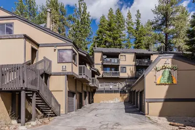 a building with a christmas tree on the side of it at Bigwood W #90 in Mammoth Lakes