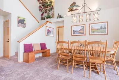 a dining room with a table and chairs at Snowcreek #856 Phase V in Mammoth Lakes