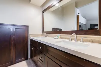 a bathroom with a sink and a large mirror at Snowcreek #856 Phase V in Mammoth Lakes