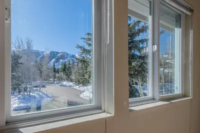 a window with a view of a snow covered mountain at Snowcreek - #510 Phase IV in Mammoth Lakes