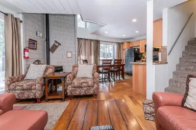 a living room with a couch and chairs and a table at Sierra Park Villas N-#66 in Mammoth Lakes