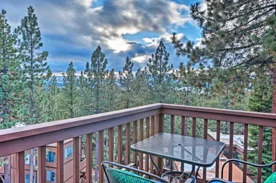 a table and chairs on a balcony with trees at 2 Mi to Heavenly Mountain Tahoe Retreat with Views in Stateline