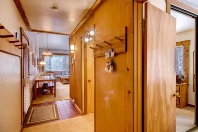 a hallway of a home with a dining room at Ski-InandSki-Out Northstar Condo Near Lake Tahoe! in Truckee
