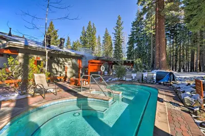 a house with a swimming pool next to a house at Ski-InandSki-Out Northstar Condo Near Lake Tahoe! in Truckee