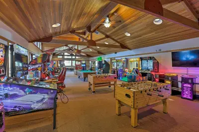 a room filled with lots of different types of games at Ski-InandSki-Out Northstar Condo Near Lake Tahoe! in Truckee