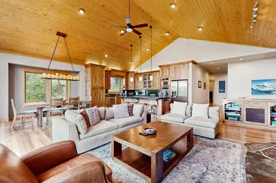 a living room with a couch and a table at Extraordinary Tahoe-Donner Modern Mountain Home in Truckee