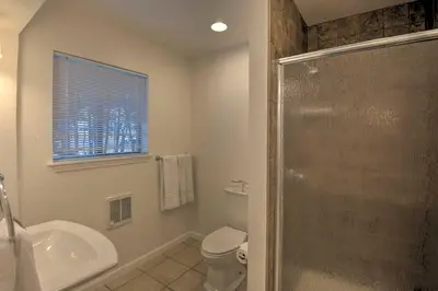 a bathroom with a shower and a toilet and a sink at Stateline Ski House Walk to Boulder Lift! in Stateline