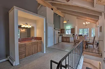 a large kitchen and living room with a dining room at Stateline Ski House Walk to Boulder Lift! in Stateline