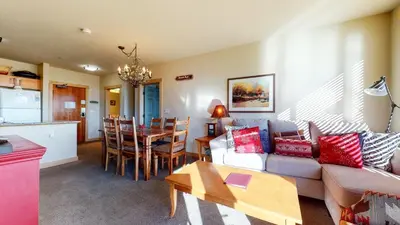 a living room with a couch and a table at Sunstone #209 condo in Mammoth Lakes
