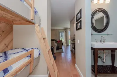 a bedroom with a bunk bed and a sink in a room at Snowcreek I 33 in Mammoth Lakes