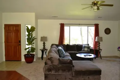 a living room with a couch and a table at Blue Jay Paradise in Three Rivers
